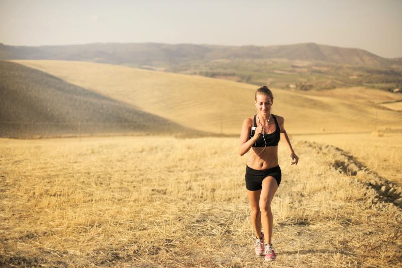 A individual running long distance on a lonely road